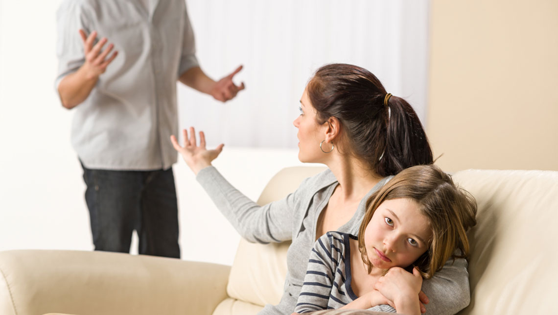 Parents arguing, unhappy daughter